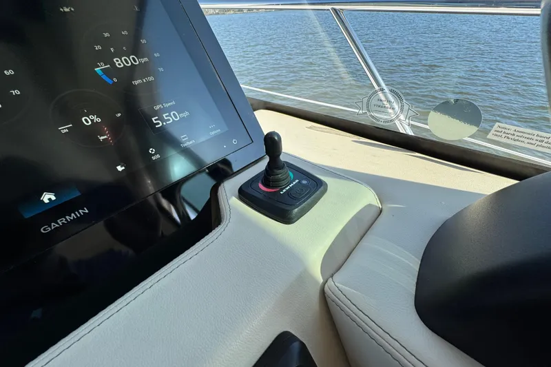 Slide: The Image of 2021 Regal 38 XO boat dashboard with Garmin display and joystick control. - 35