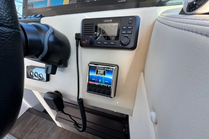 Slide: The Image of Control panel of 2021 Regal 38 XO boat with Garmin navigation system. - 37