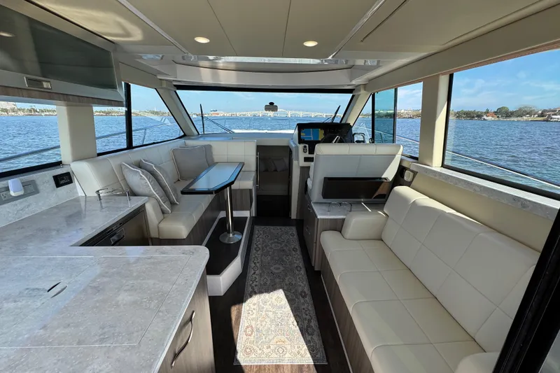 Slide: The Image of Luxurious interior of 2021 Regal 38 XO yacht with elegant seating and scenic water views. - 42