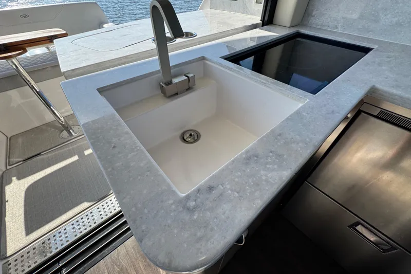 Slide: The Image of Luxury yacht kitchen with modern sink and stovetop, Regal 38 XO, 2021 model. - 46