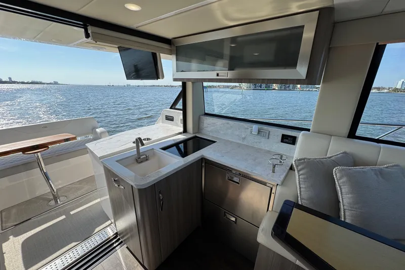 Slide: The Image of Luxurious interior of 2021 Regal 38 XO yacht with modern kitchen and ocean view. - 47
