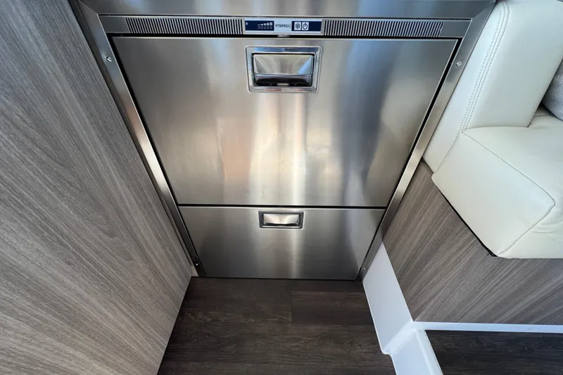 Slide: The Image of Stainless steel refrigerator in 2021 Regal 38 XO yacht interior. - 48