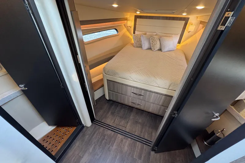 Slide: The Image of Luxurious cabin interior of 2021 Regal 38 XO yacht with cozy bed and modern design. - 54
