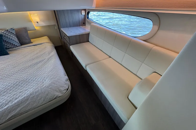 Slide: The Image of Luxurious interior of 2021 Regal 38 XO yacht with bed and seating area. - 58