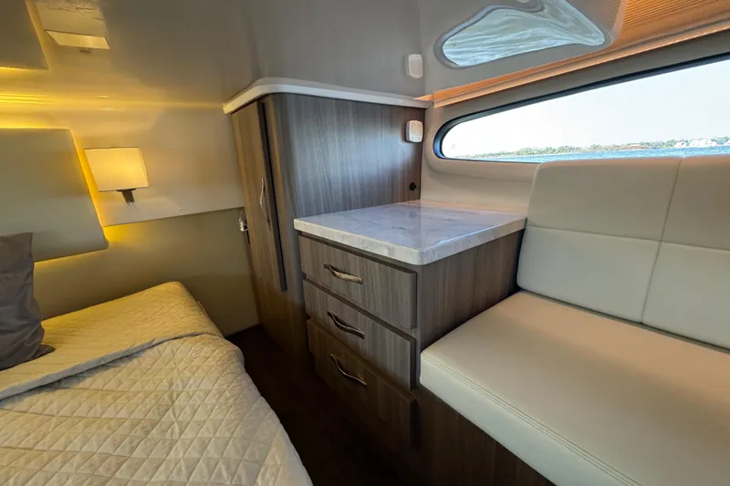 Slide: The Image of Luxurious interior of 2021 Regal 38 XO yacht with elegant wood cabinetry and cozy seating. - 59