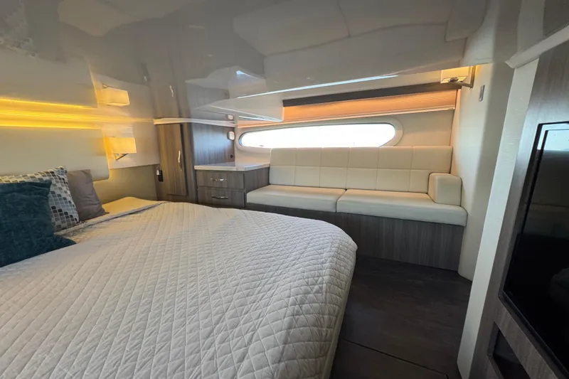 Slide: The Image of Luxurious interior of 2021 Regal 38 XO yacht with bed and seating area. - 63