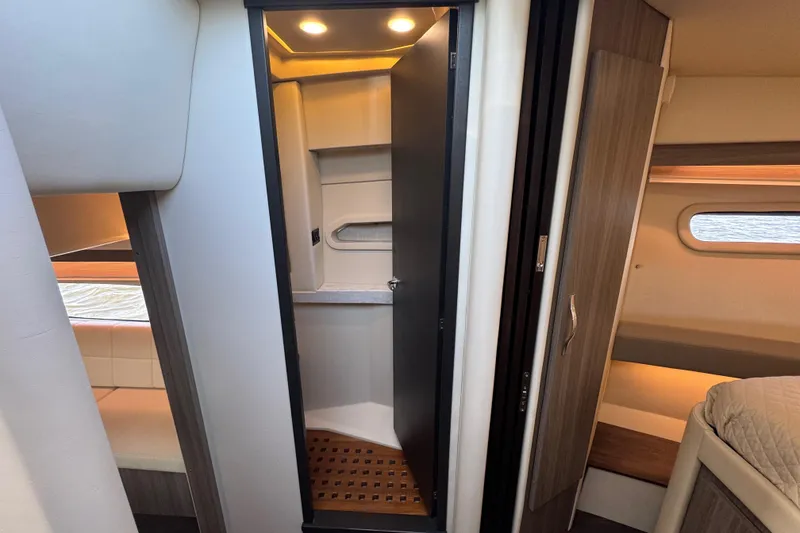 Slide: The Image of 2021 Regal 38 XO yacht interior with modern bathroom and cozy cabin. - 69