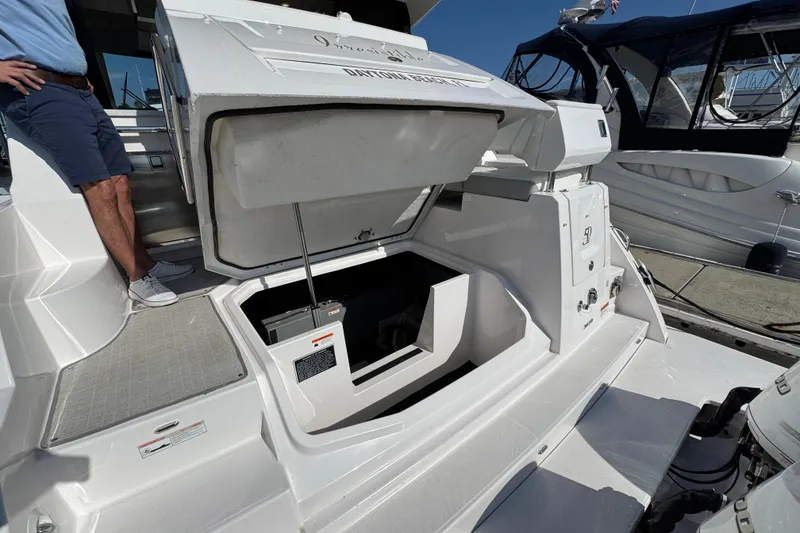 Slide: The Image of 2021 Regal 38 XO yacht with open storage compartment at the stern. - 71