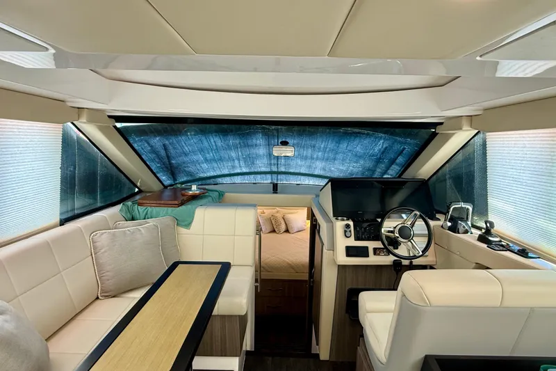 Slide: The Image of Interior of 2021 Regal 38 XO yacht with modern helm and seating area. - 79