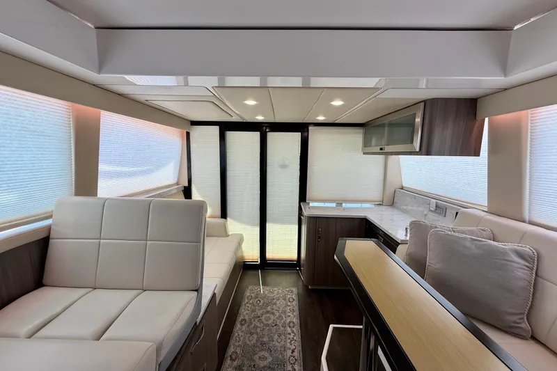 Slide: The Image of Luxurious interior of 2021 Regal 38 XO yacht with modern seating and elegant design. - 80