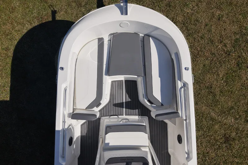 Slide: The Image of 2025 Bayliner Trophy T22CC boat interior, top view, showcasing seating and deck layout. - 10