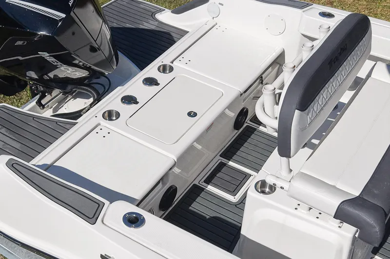 Slide: The Image of 2025 Bayliner Trophy T22CC boat interior with seating and storage features. - 11