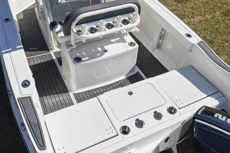 Slide: The Image of 2025 Bayliner Trophy T22CC boat interior with seating and storage compartments. - 12