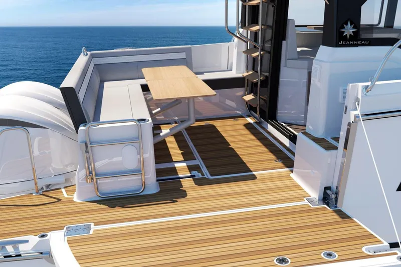Slide: The Image of Manufacturer Provided Image: 2026 Jeanneau NC 1095 Fly Series 2 yacht deck with seating and table, overlooking the ocean. - 5