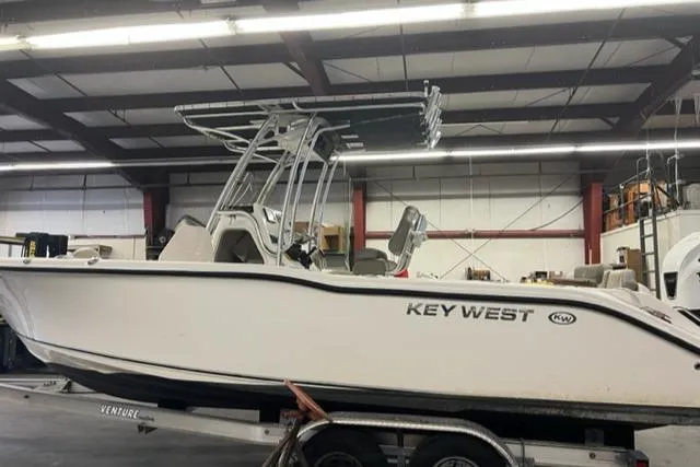 The Image of 2020 Key West 239 FS boat on trailer in indoor storage facility. - 0