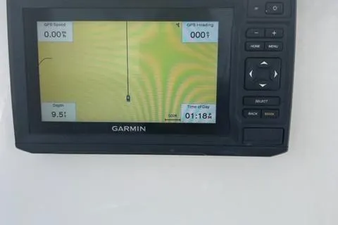 Slide: The Image of Garmin GPS display on 2020 Key West 239 FS boat, showing speed, heading, depth, and time. - 11