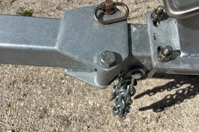 Slide: The Image of Trailer hitch of a 2026 Key West 1720 Center Console boat. - 10