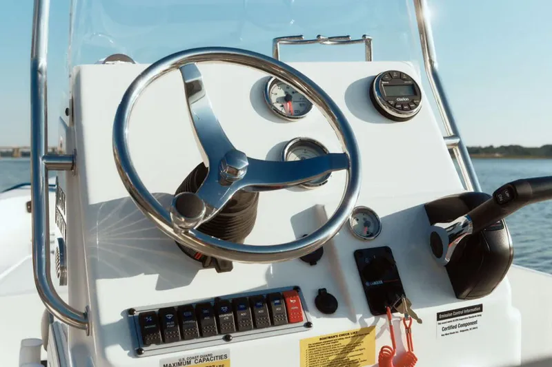 Slide: The Image of Manufacturer Provided Image: 2025 Key West 1720 Center Console boat dashboard with steering wheel and controls. - 3