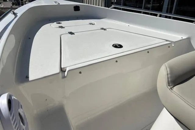 Slide: The Image of 2026 Key West 1720 Center Console boat deck with storage compartments. - 9