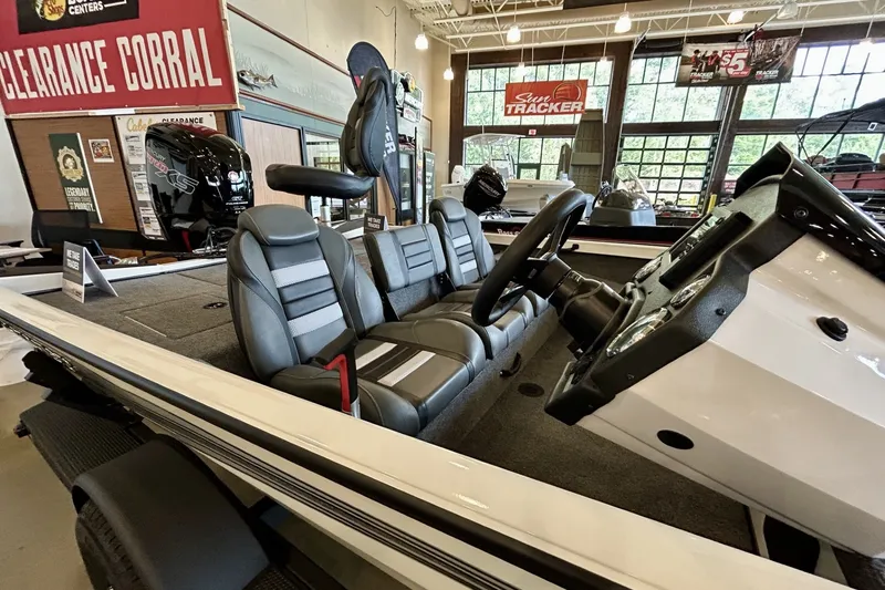 Slide: The Image of 2026 Ranger RT188 boat interior with steering wheel and seating in showroom. - 1
