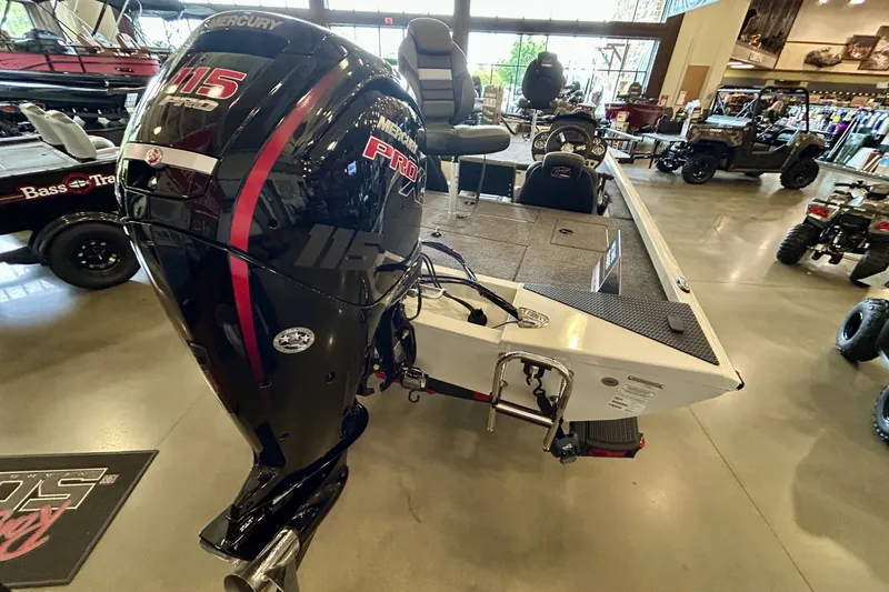 Slide: The Image of 2026 Ranger RT188 boat with Mercury 115 Pro XS engine displayed indoors. - 4