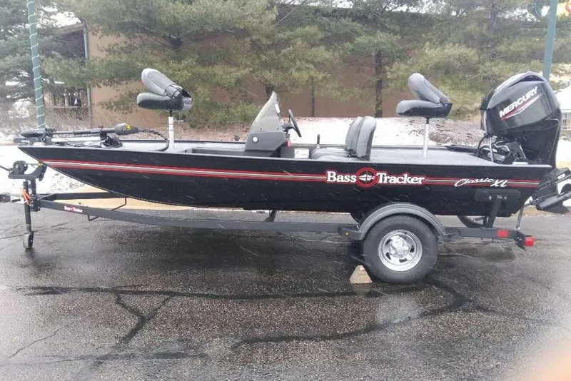 The Image of 2026 Tracker Bass Tracker Classic XL boat on trailer, parked outdoors. - 0