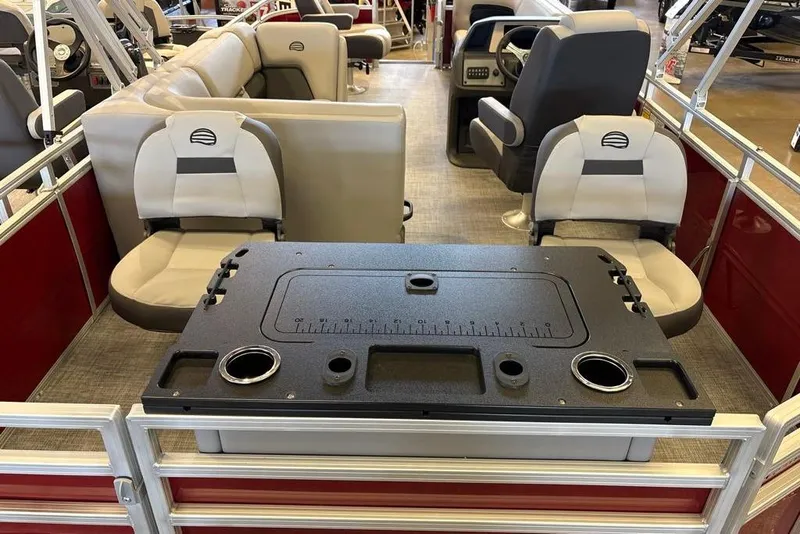 Slide: The Image of 2026 Sun Tracker SportFish 20 DLX interior with seating and fishing table. - 3
