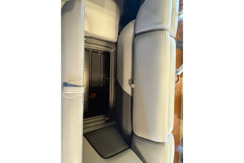 Slide: The Image of Sun Tracker SportFish 20 DLX 2026 boat seat with storage compartment open. - 17