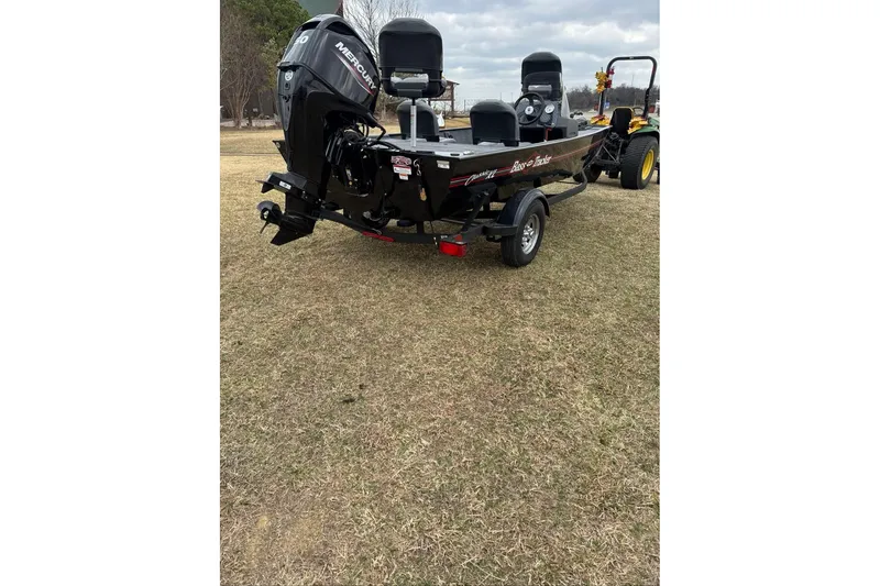 Slide: The Image of 2026 Tracker Bass Tracker Classic XL boat on trailer, parked on grass. - 3