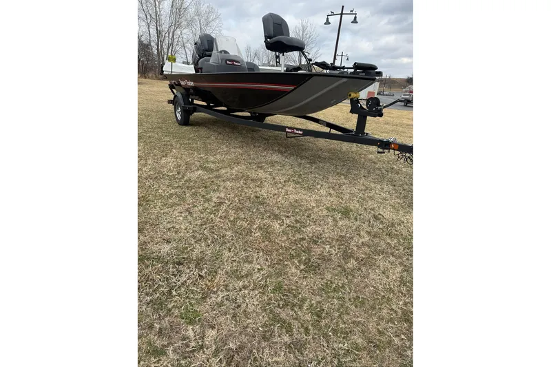 Slide: The Image of 2026 Tracker Bass Tracker Classic XL boat on trailer, parked on grass. - 5