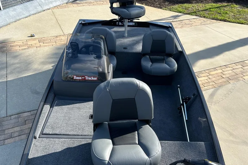 Slide: The Image of 2026 Tracker Bass Tracker Classic XL boat interior with seating and steering console. - 4