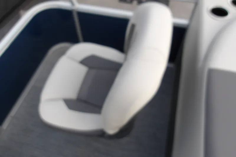 Slide: The Image of Blurry view of a seat on a 2026 Sun Tracker Bass Buggy 18 DLX boat. - 17