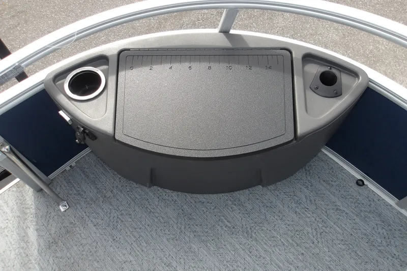 Slide: The Image of 2026 Sun Tracker Bass Buggy 18 DLX boat console with cup holders and measurement panel. - 23