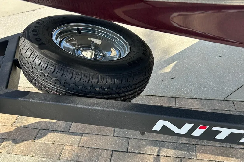Slide: The Image of Spare tire on Nitro Z17 trailer, 2025 model, parked on paved surface. - 10