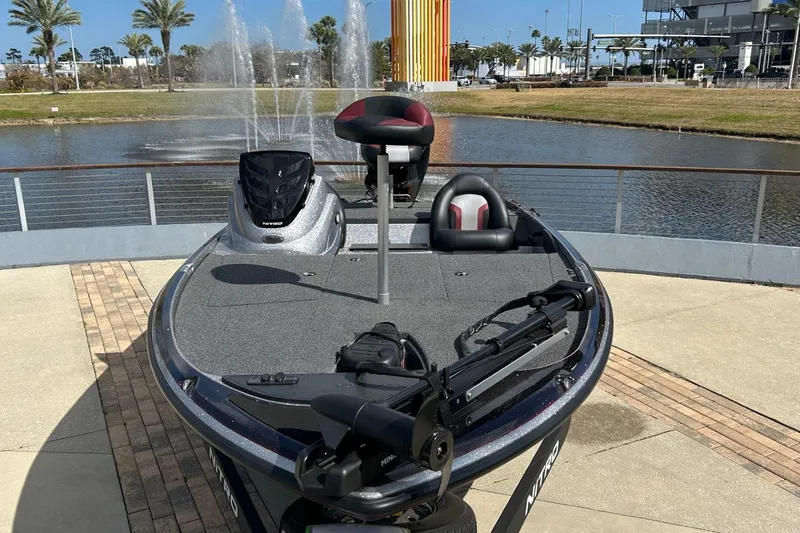 Slide: The Image of 2025 Nitro Z17 boat docked by a scenic fountain and palm trees. - 3