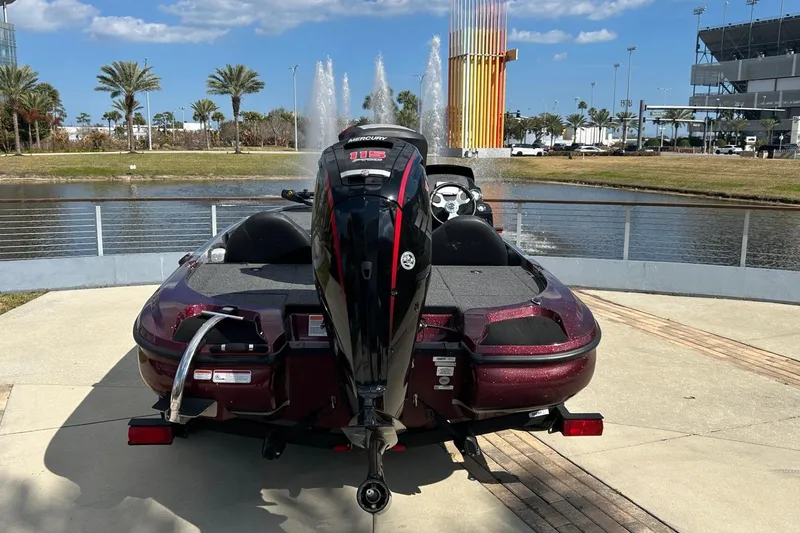 Slide: The Image of 2025 Nitro Z17 boat with Mercury engine, parked near a fountain and palm trees. - 8