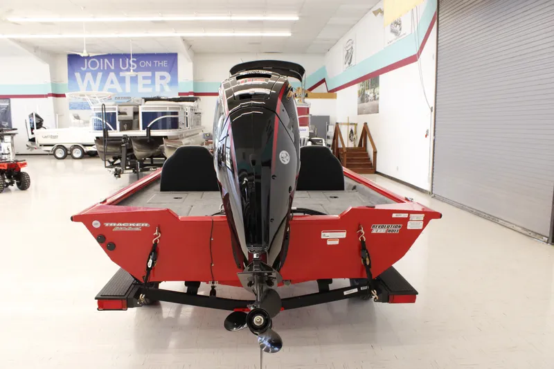 Slide: The Image of 2026 Tracker Pro Team 190 boat in showroom, rear view with motor. - 3