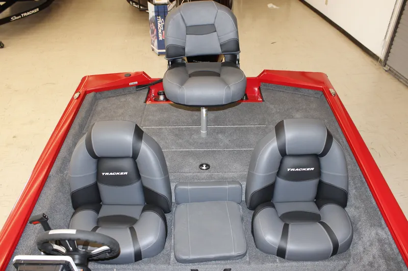 Slide: The Image of 2026 Tracker Pro Team 190 boat interior with gray seating and red accents. - 10