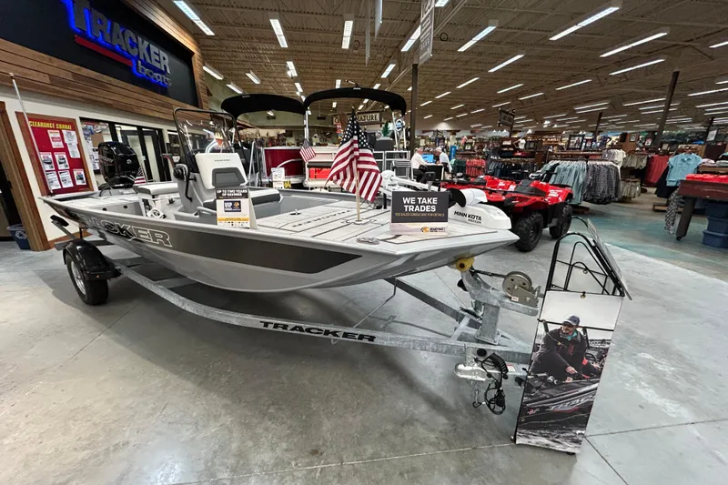 The Image of 2026 Tracker Bass Tracker Classic CC boat displayed in a showroom with trade-in options. - 0