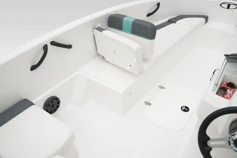 Slide: The Image of 2026 Tahoe T16 boat interior with seating and steering wheel, showcasing modern design. - 18