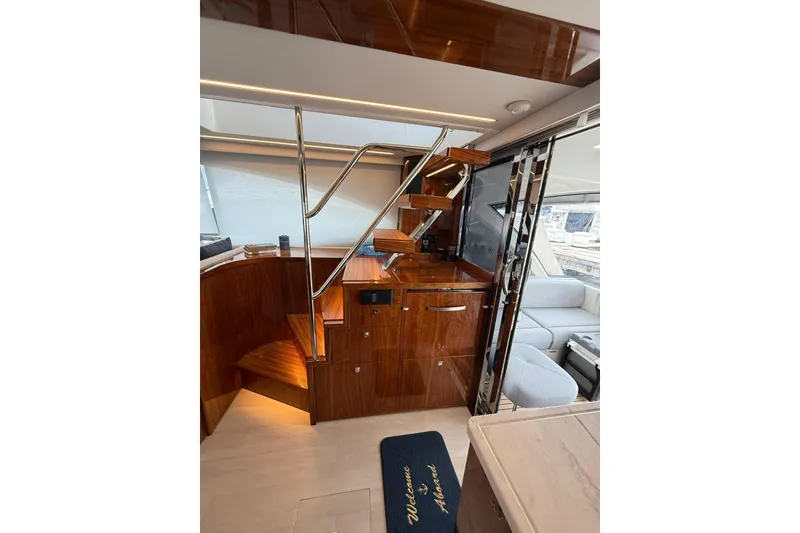 Slide: The Image of Luxurious interior of 2025 Riviera 50 Sports Motor Yacht with polished wood and modern design. - 7