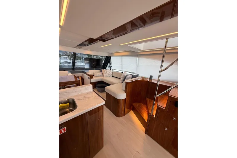 Slide: The Image of Luxurious interior of 2025 Riviera 50 Sports Motor Yacht with modern furnishings and elegant design. - 8