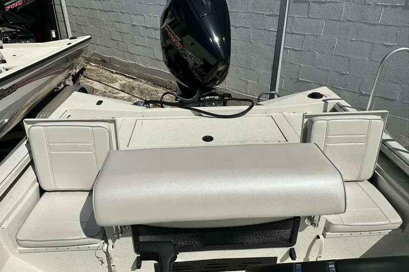 Slide: The Image of 2025 Ranger RB210 boat interior with seating and outboard motor. - 20