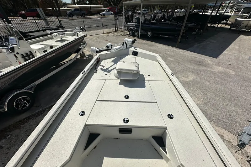 Slide: The Image of 2025 Ranger RB210 boat on display at a dealership, showcasing spacious deck design. - 6