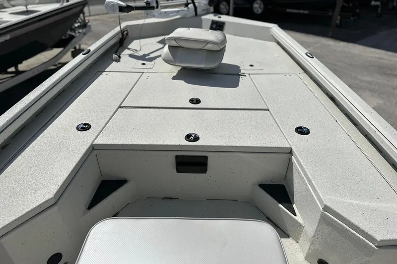 Slide: The Image of 2025 Ranger RB210 boat deck with seating and storage compartments. - 9