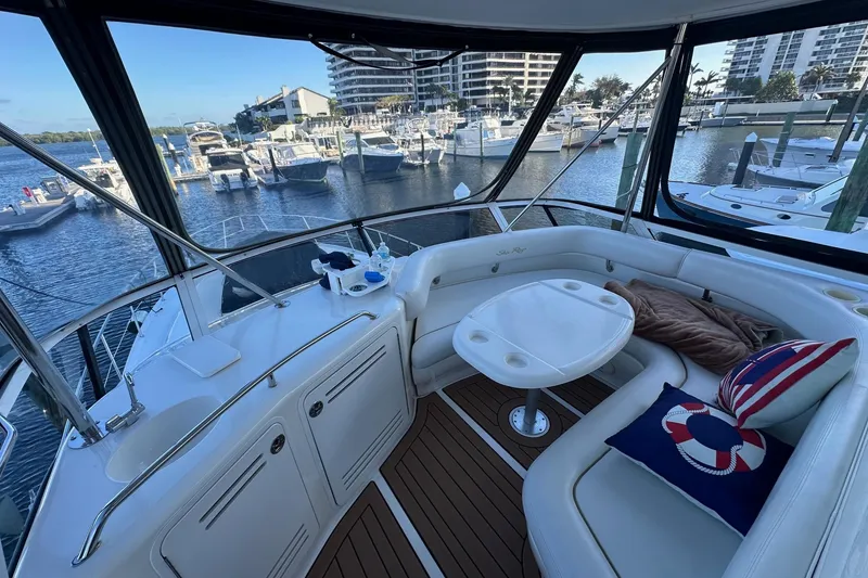 Slide: The Image of Luxurious 1998 Sea Ray 480 Sedan Bridge yacht interior with marina view. - 18