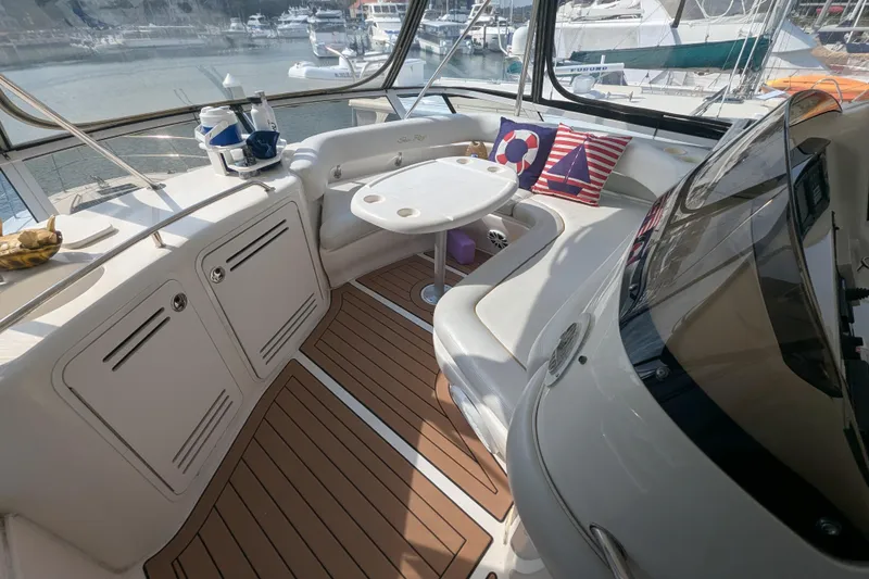 Slide: The Image of Luxurious 1998 Sea Ray 480 Sedan Bridge yacht interior with seating and nautical decor. - 24