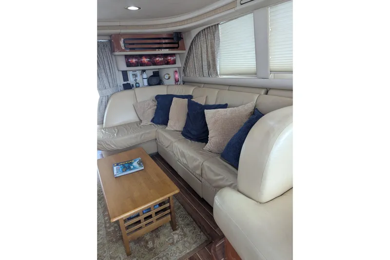 Slide: The Image of Luxurious interior of 1998 Sea Ray 480 Sedan Bridge with plush seating and elegant decor. - 28