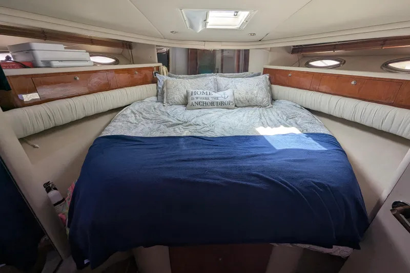 Slide: The Image of Cozy bedroom interior of 1998 Sea Ray 480 Sedan Bridge yacht with nautical decor. - 31