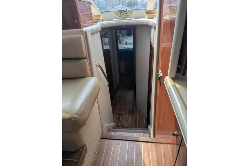 Slide: The Image of Interior view of 1998 Sea Ray 480 Sedan Bridge yacht with wooden flooring. - 34